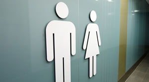 picture of a man and woman symbol on a toilet wall